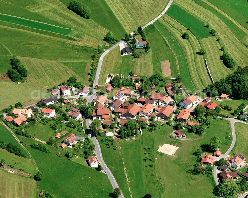 Köppenreut from above - Agricultural land and field boundaries surround the settlement area of the village in Köppenreut in the state Bavaria, Germany