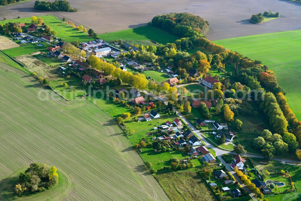 Körchow from the bird's eye view: Agricultural land and field boundaries surround the settlement area of the village in Koerchow in the state Mecklenburg - Western Pomerania, Germany