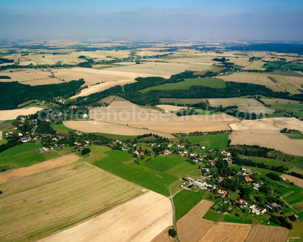 Aerial image Krummenhennersdorf - Agricultural land and field boundaries surround the settlement area of the village in Krummenhennersdorf in the state Saxony, Germany