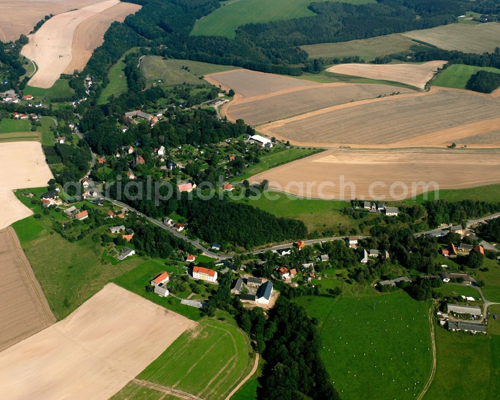 Krummenhennersdorf from above - Agricultural land and field boundaries surround the settlement area of the village in Krummenhennersdorf in the state Saxony, Germany