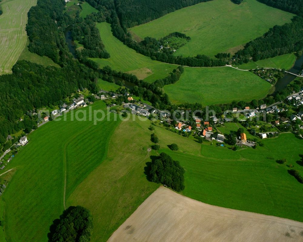 Kunnersdorf from above - Agricultural land and field boundaries surround the settlement area of the village in Kunnersdorf in the state Saxony, Germany