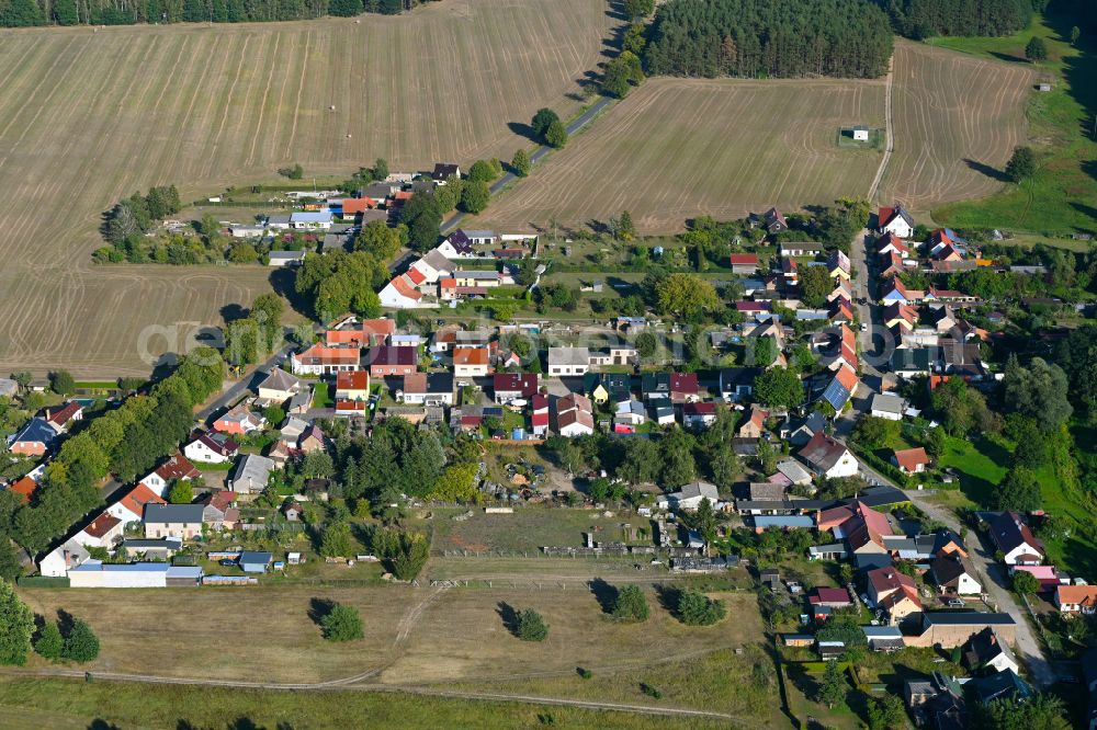 Aerial image Kurtschlag - Agricultural land and field boundaries surround the settlement area of the village in Kurtschlag in the state Brandenburg, Germany