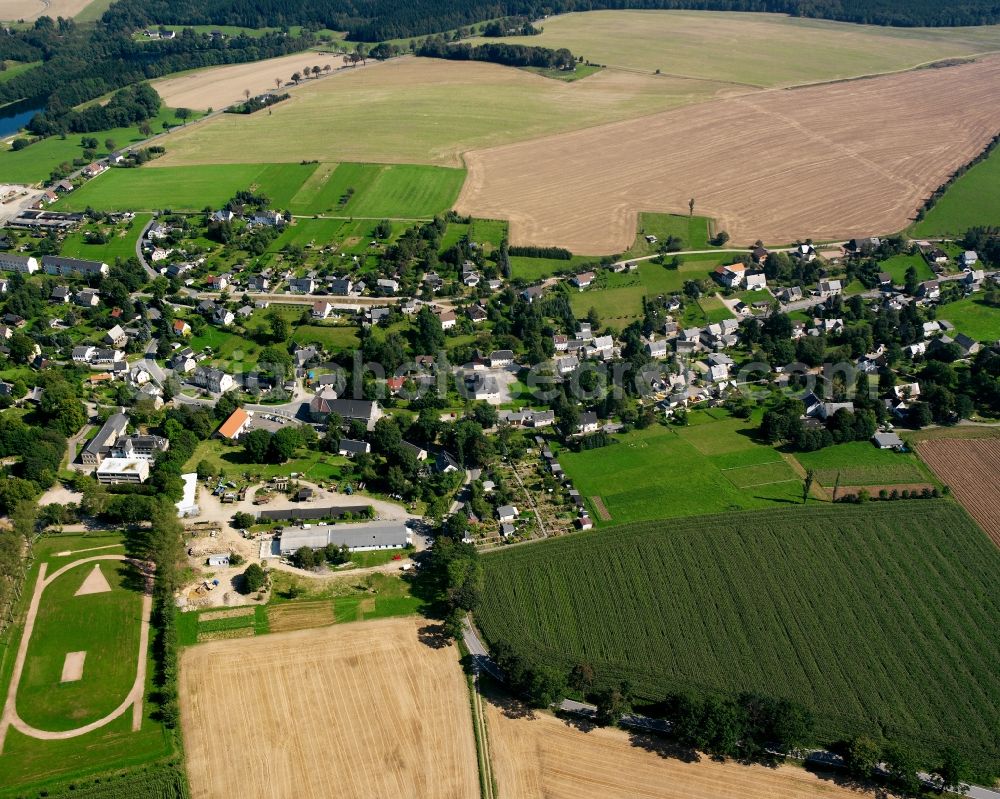Langenau from above - Agricultural land and field boundaries surround the settlement area of the village in Langenau in the state Saxony, Germany