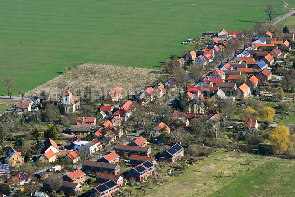 Langerwisch from the bird's eye view: Agricultural land and field boundaries surround the settlement area of the village on street Neu-Langerwisch in Langerwisch in the state Brandenburg, Germany