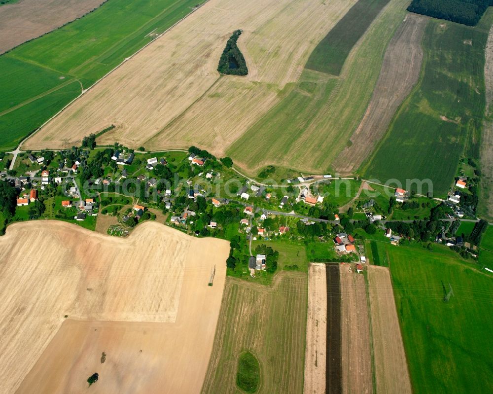 Langhennersdorf from above - Agricultural land and field boundaries surround the settlement area of the village in Langhennersdorf in the state Saxony, Germany