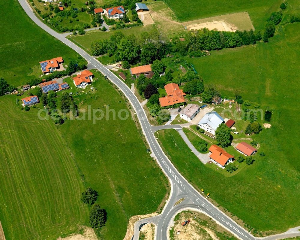 Aerial photograph Laßberg - Agricultural land and field boundaries surround the settlement area of the village in Laßberg in the state Bavaria, Germany
