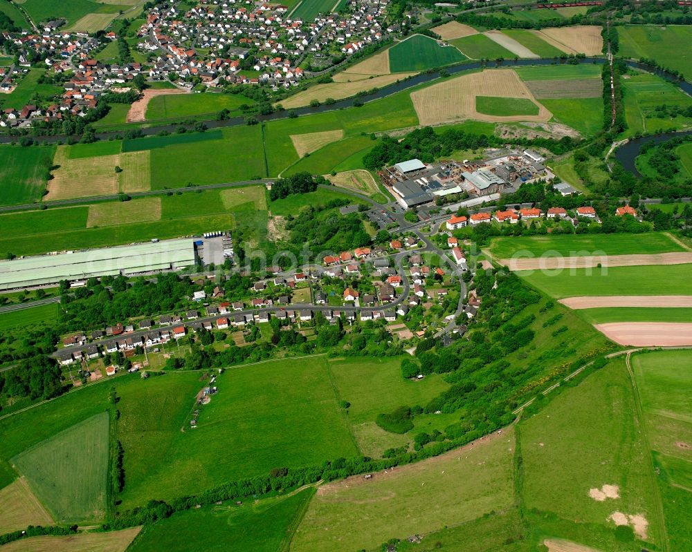 Aerial image Lengers - Agricultural land and field boundaries surround the settlement area of the village in Lengers in the state Hesse, Germany