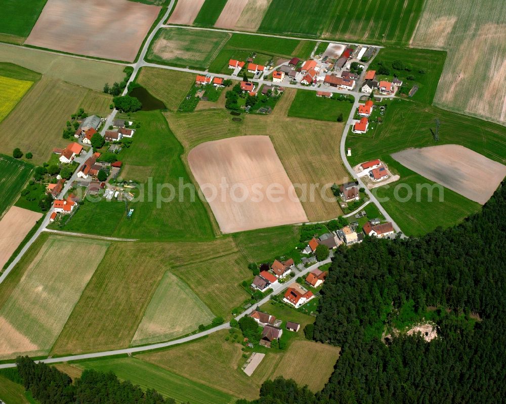 Lichtenau from the bird's eye view: Agricultural land and field boundaries surround the settlement area of the village in Lichtenau in the state Bavaria, Germany