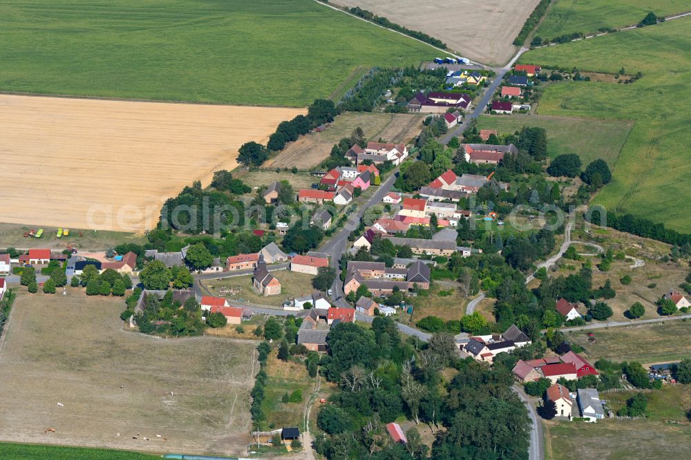 Aerial image Lindow - Agricultural land and field boundaries surround the settlement area of the village in Lindow in the state Brandenburg, Germany