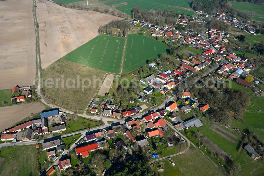 Linow from above - Agricultural land and field boundaries surround the settlement area of the village in Linow in the state Brandenburg, Germany