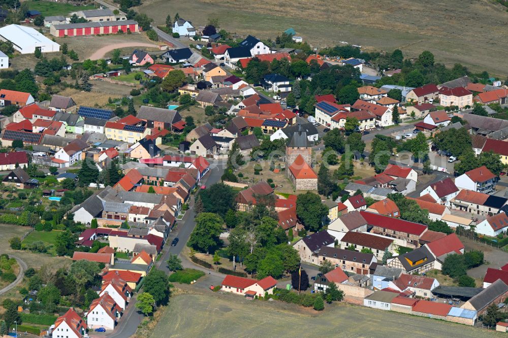 Aerial image Linthe - Agricultural land and field boundaries surround the settlement area of the village in Linthe in the state Brandenburg, Germany