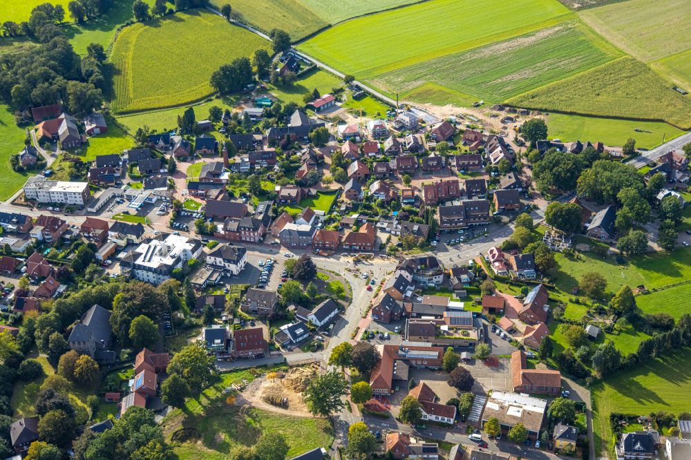 Lippramsdorf from the bird's eye view: Agricultural land and field boundaries surround the settlement area of the village in Lippramsdorf in the state North Rhine-Westphalia, Germany