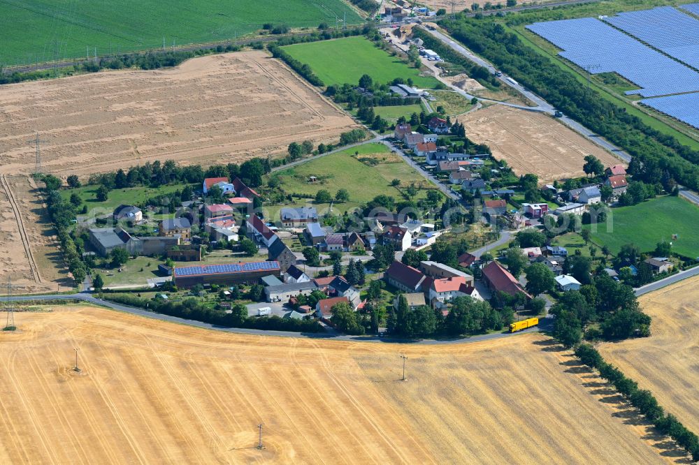 Lissa from the bird's eye view: Agricultural land and field boundaries surround the settlement area of the village in Lissa in the state Saxony, Germany