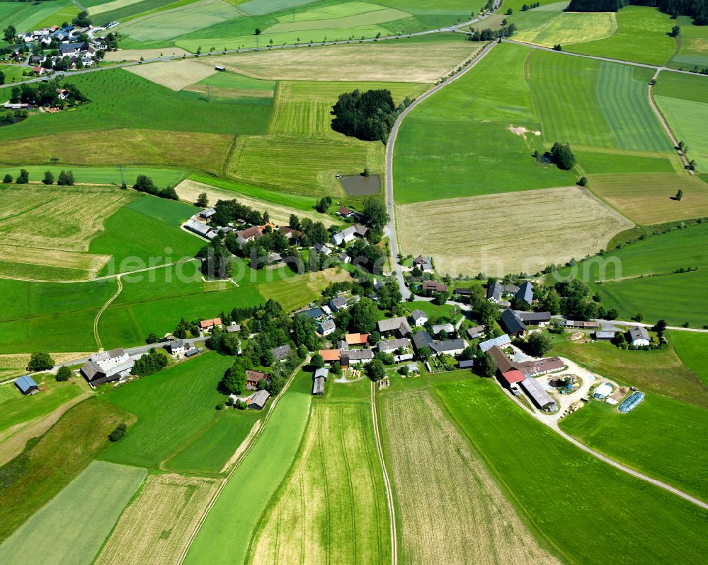 Lösten from the bird's eye view: Agricultural land and field boundaries surround the settlement area of the village in Lösten in the state Bavaria, Germany