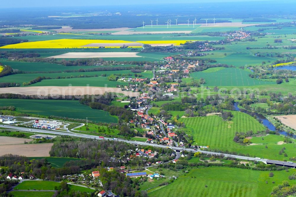 Ludwigsdorf from the bird's eye view: Agricultural land and field boundaries surround the settlement area of the village in Ludwigsdorf in the state Saxony, Germany