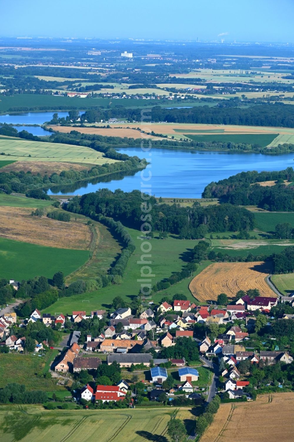Mahlis from above - Agricultural land and field boundaries surround the settlement area of the village in Mahlis in the state Saxony, Germany