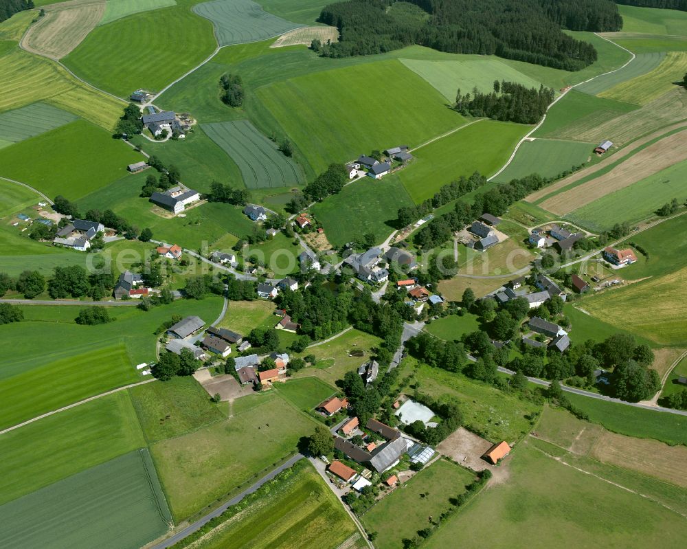 Markersreuth from above - Agricultural land and field boundaries surround the settlement area of the village in Markersreuth in the state Bavaria, Germany