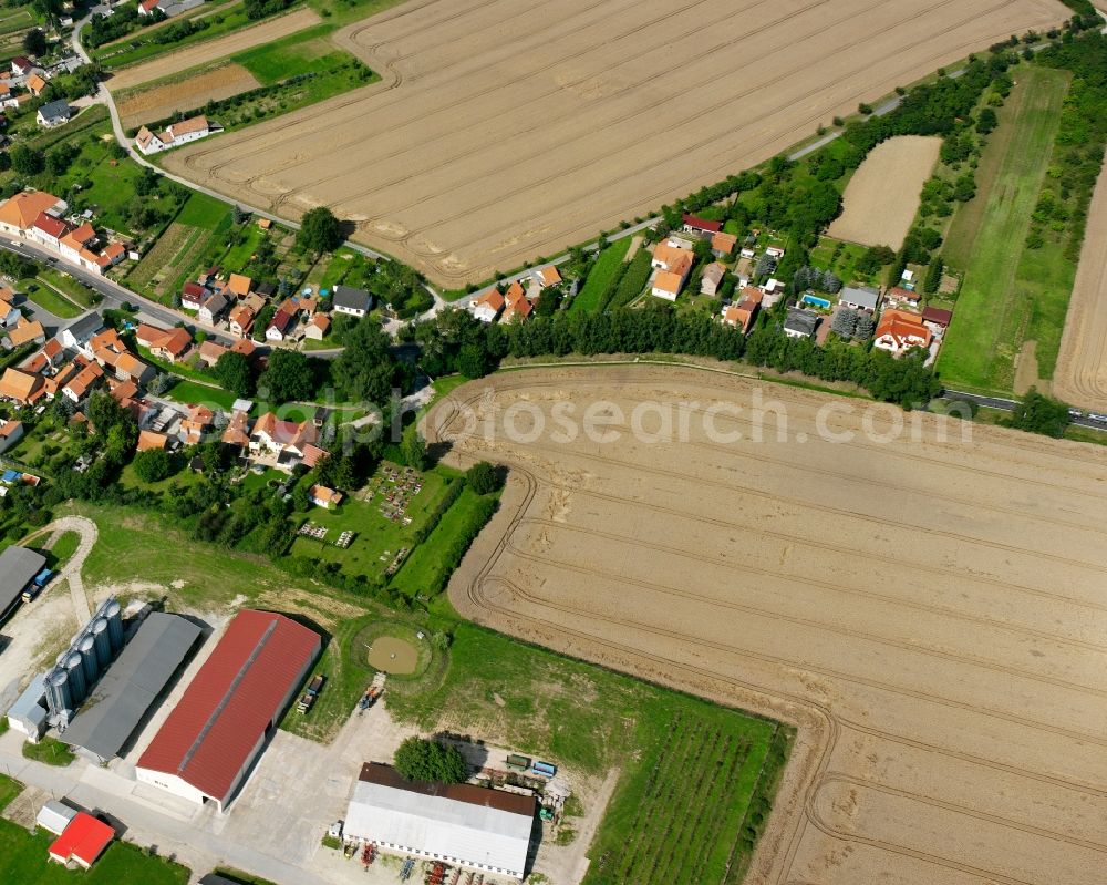 Aerial image Marolterode - Agricultural land and field boundaries surround the settlement area of the village in Marolterode in the state Thuringia, Germany