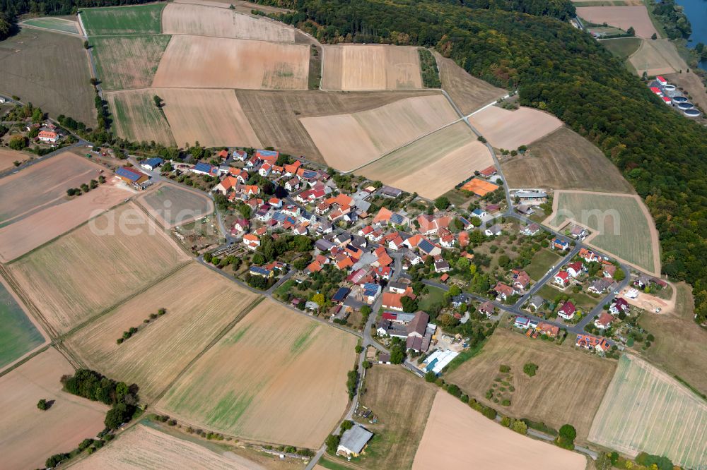 Massenbuch from above - Agricultural land and field boundaries surround the settlement area of the village in Massenbuch in the state Bavaria, Germany