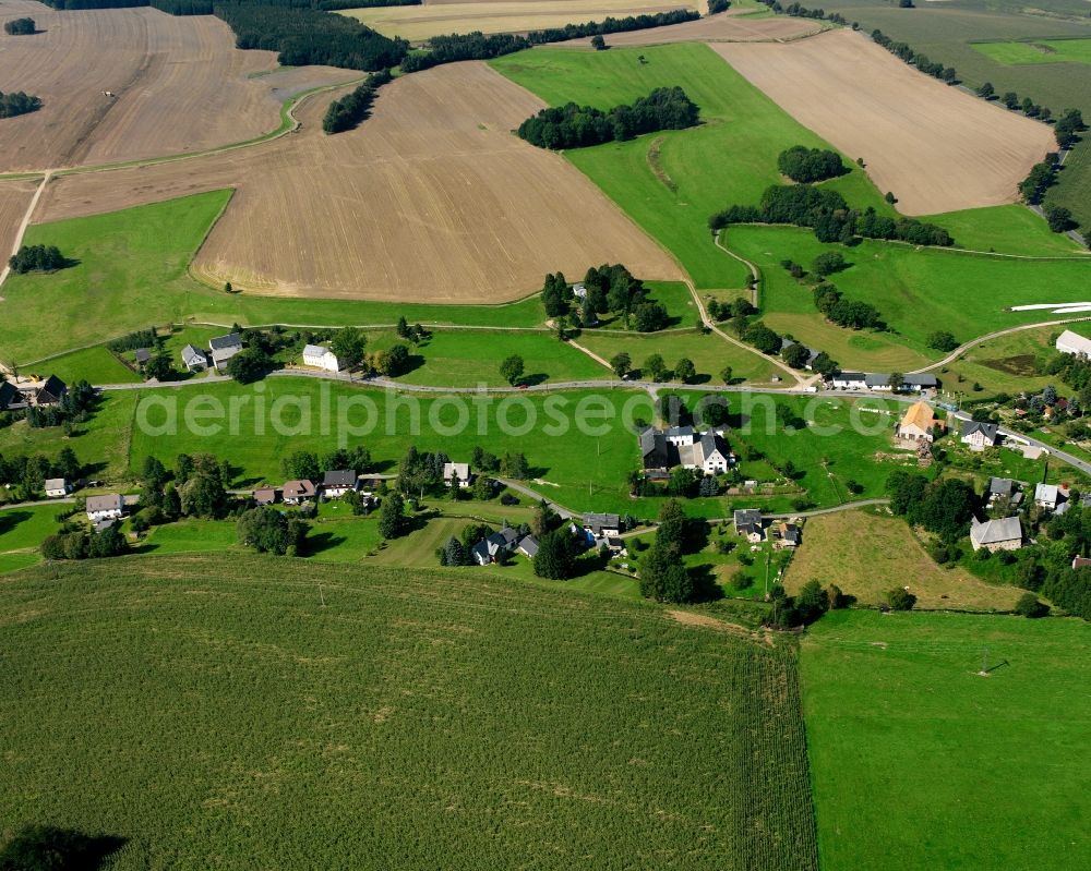 Aerial image Müdisdorf - Agricultural land and field boundaries surround the settlement area of the village in Müdisdorf in the state Saxony, Germany