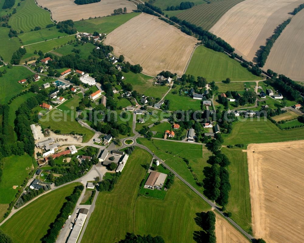 Memmendorf from above - Agricultural land and field boundaries surround the settlement area of the village in Memmendorf in the state Saxony, Germany