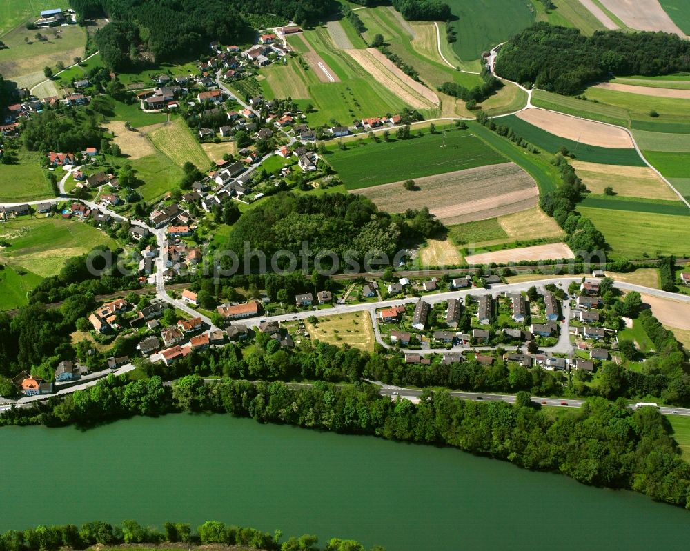 Metteberberg from the bird's eye view: Agricultural land and field boundaries surround the settlement area of the village in Metteberberg in the state Baden-Wuerttemberg, Germany