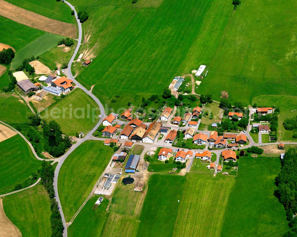 Mitterleinbach from above - Agricultural land and field boundaries surround the settlement area of the village in Mitterleinbach in the state Bavaria, Germany