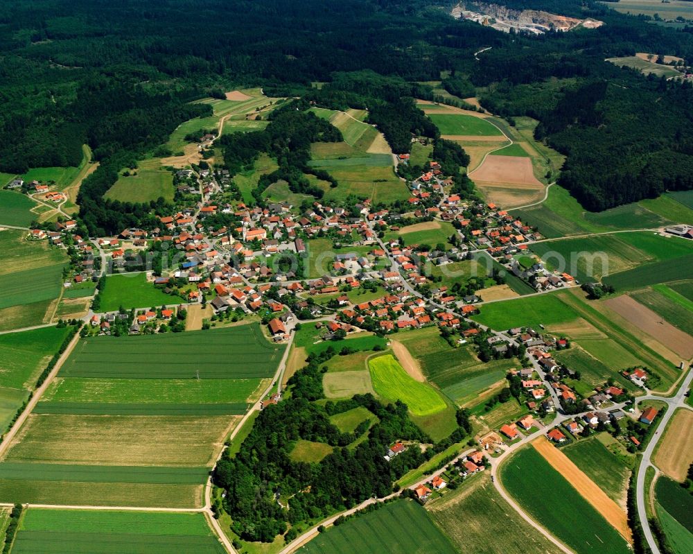 Aerial image Münster - Agricultural land and field boundaries surround the settlement area of the village in Münster in the state Bavaria, Germany