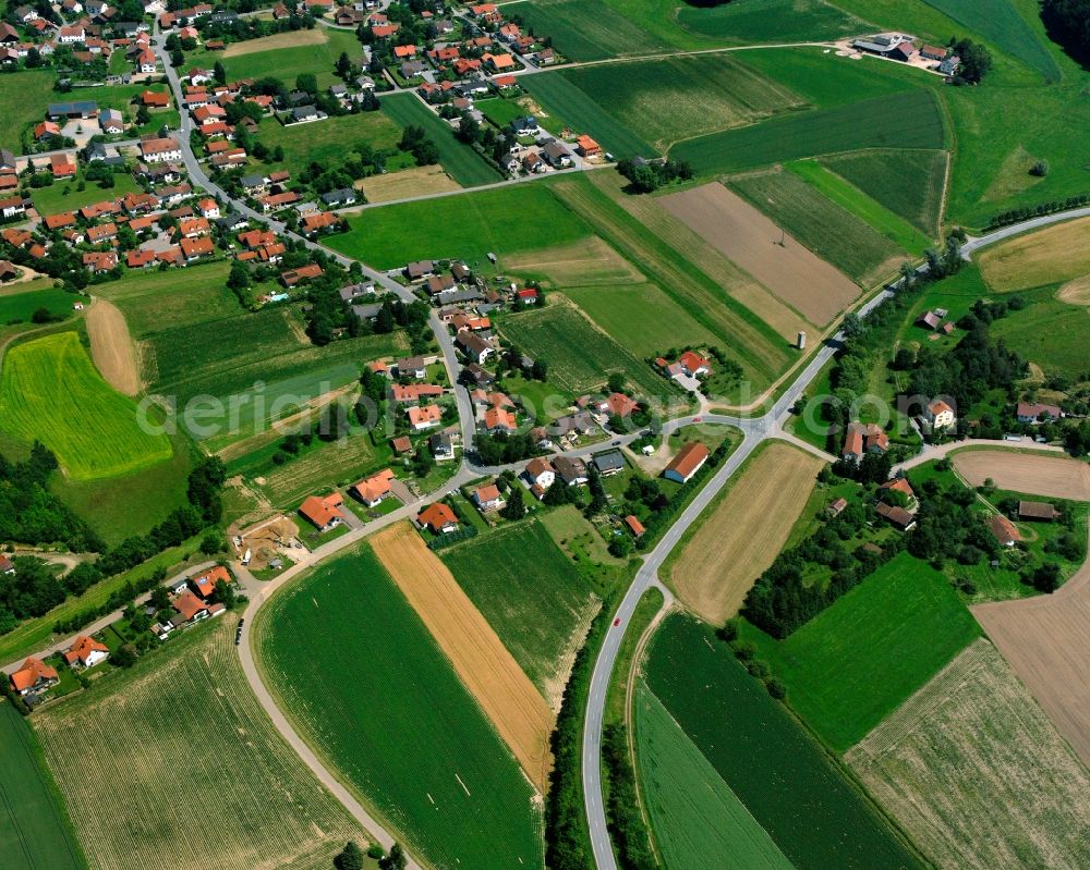 Münster from the bird's eye view: Agricultural land and field boundaries surround the settlement area of the village in Münster in the state Bavaria, Germany