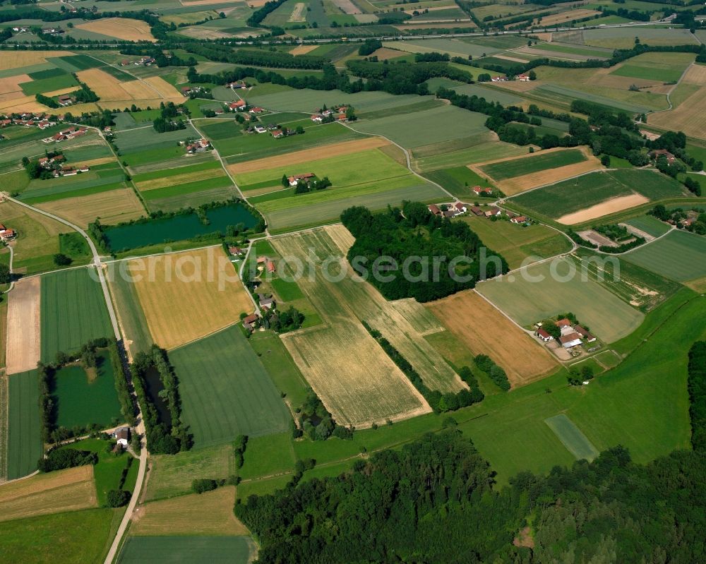 Moos from the bird's eye view: Agricultural land and field boundaries surround the settlement area of the village in Moos in the state Bavaria, Germany
