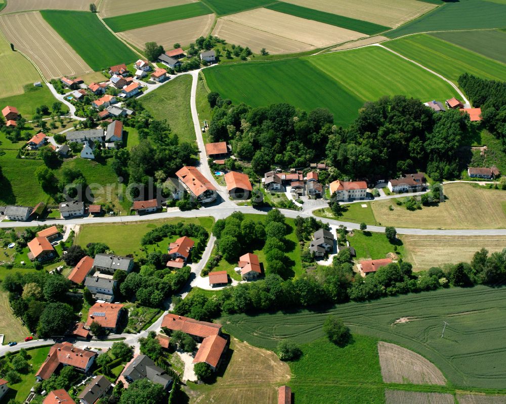 Aerial image Mörmoosen - Agricultural land and field boundaries surround the settlement area of the village in Mörmoosen in the state Bavaria, Germany