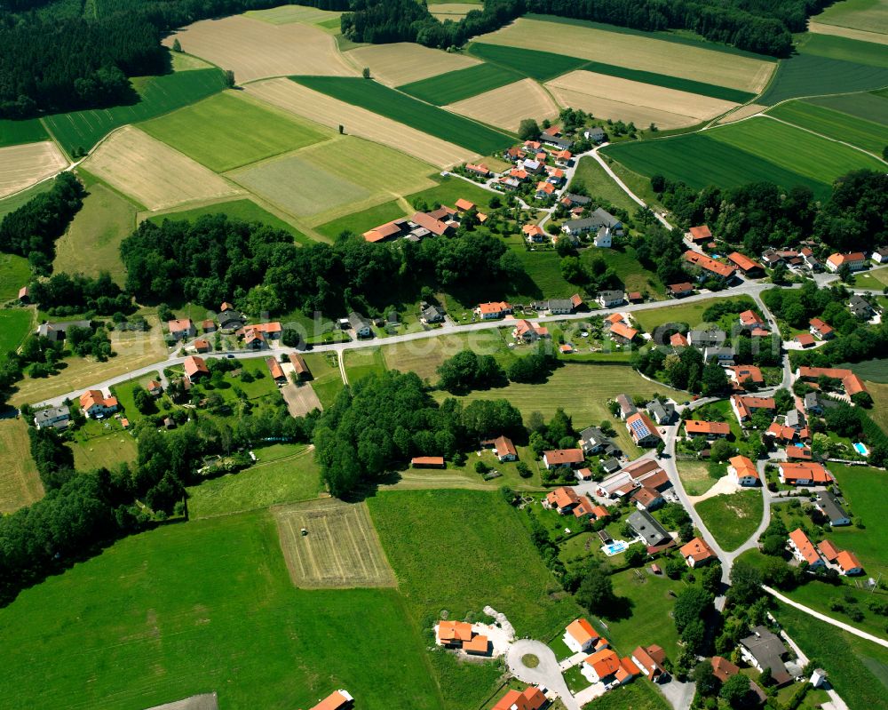 Mörmoosen from the bird's eye view: Agricultural land and field boundaries surround the settlement area of the village in Mörmoosen in the state Bavaria, Germany