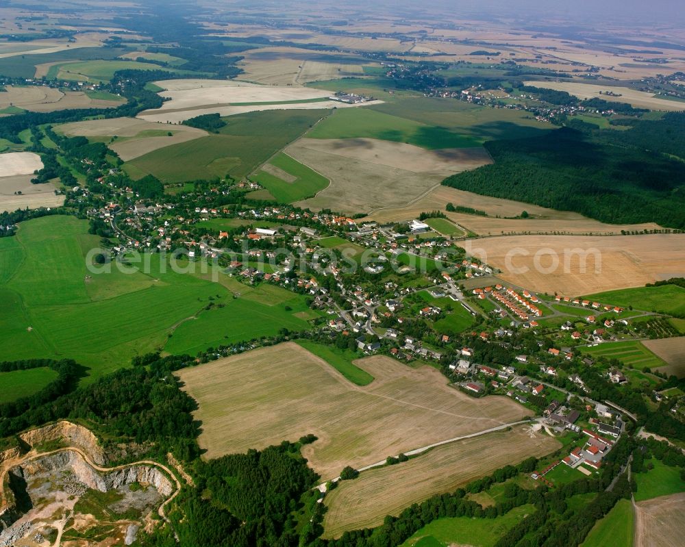 Naundorf from above - Agricultural land and field boundaries surround the settlement area of the village in Naundorf in the state Saxony, Germany