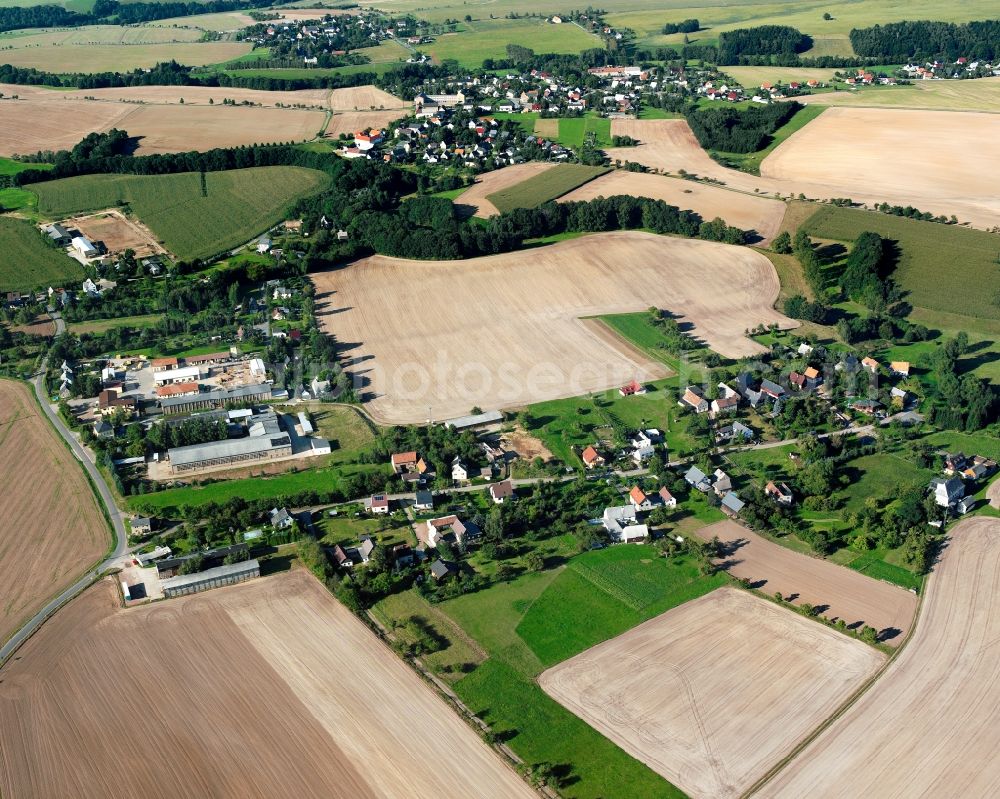 Aerial image Naundorf - Agricultural land and field boundaries surround the settlement area of the village in Naundorf in the state Saxony, Germany