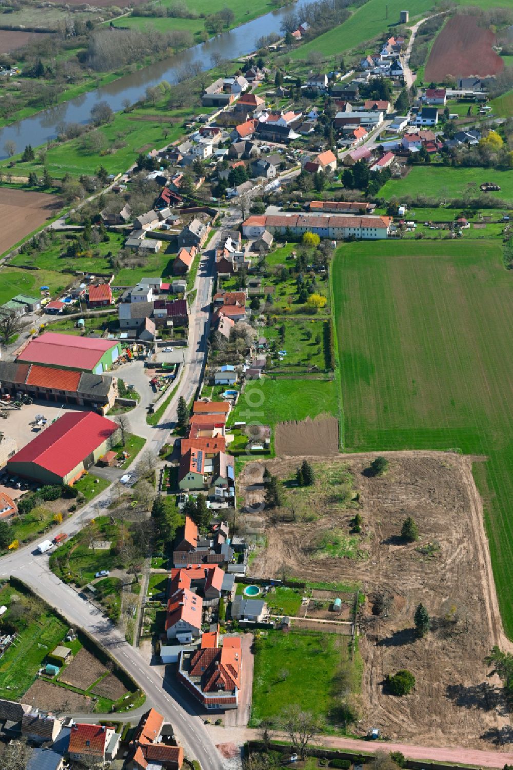 Aerial photograph Nelben - Agricultural land and field boundaries surround the settlement area of the village in Nelben in the state Saxony-Anhalt, Germany