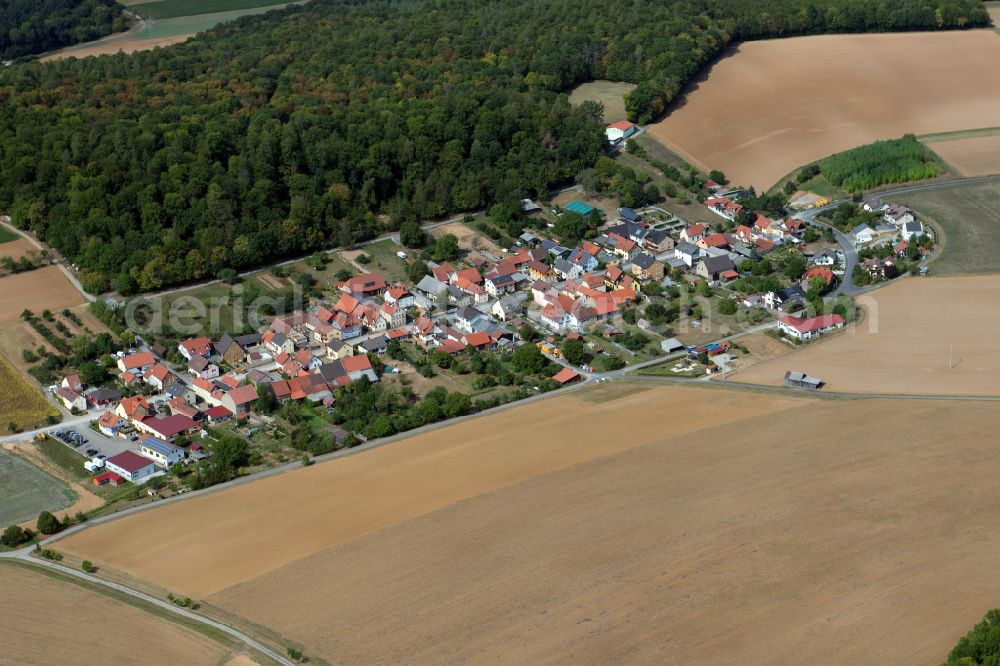 Aerial image Neubessingen - Agricultural land and field boundaries surround the settlement area of the village in Neubessingen in the state Bavaria, Germany
