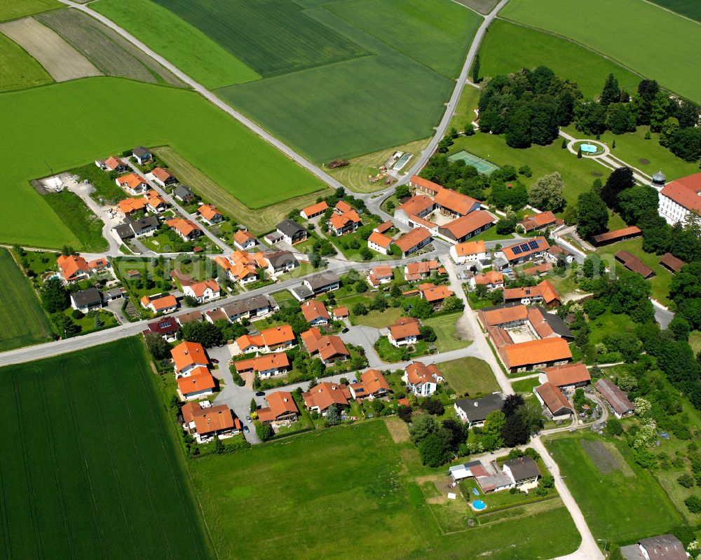 Aerial photograph Neue Heimat - Agricultural land and field boundaries surround the settlement area of the village in Neue Heimat in the state Bavaria, Germany