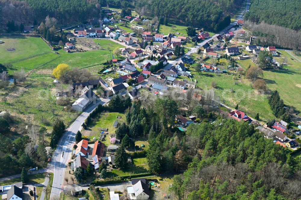 Aerial image Neuehütten - Agricultural land and field boundaries surround the settlement area of the village in Neuehütten in the state Brandenburg, Germany