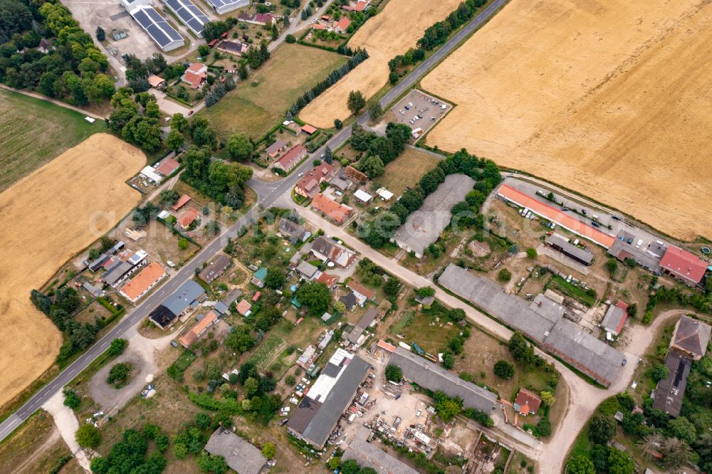 Aerial photograph Oderberg - Agricultural land and field boundaries surround the settlement area of the village Neuendorf on street Neuendorf in Oderberg in the state Brandenburg, Germany