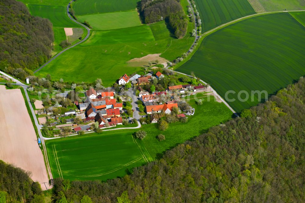 Neugrub from above - Agricultural land and field boundaries surround the settlement area of the village in Neugrub in the state Bavaria, Germany