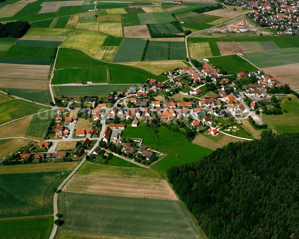 Aerial photograph Neuses - Agricultural land and field boundaries surround the settlement area of the village in Neuses in the state Bavaria, Germany