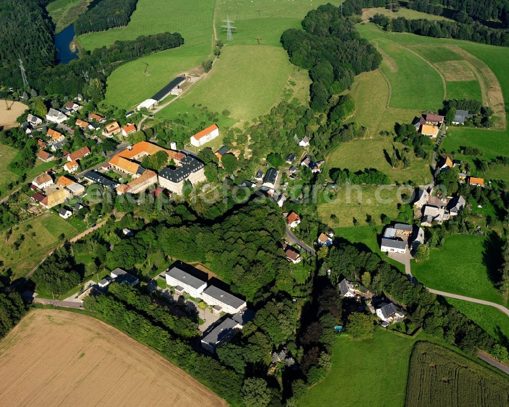 Neusorge from above - Agricultural land and field boundaries surround the settlement area of the village in Neusorge in the state Saxony, Germany