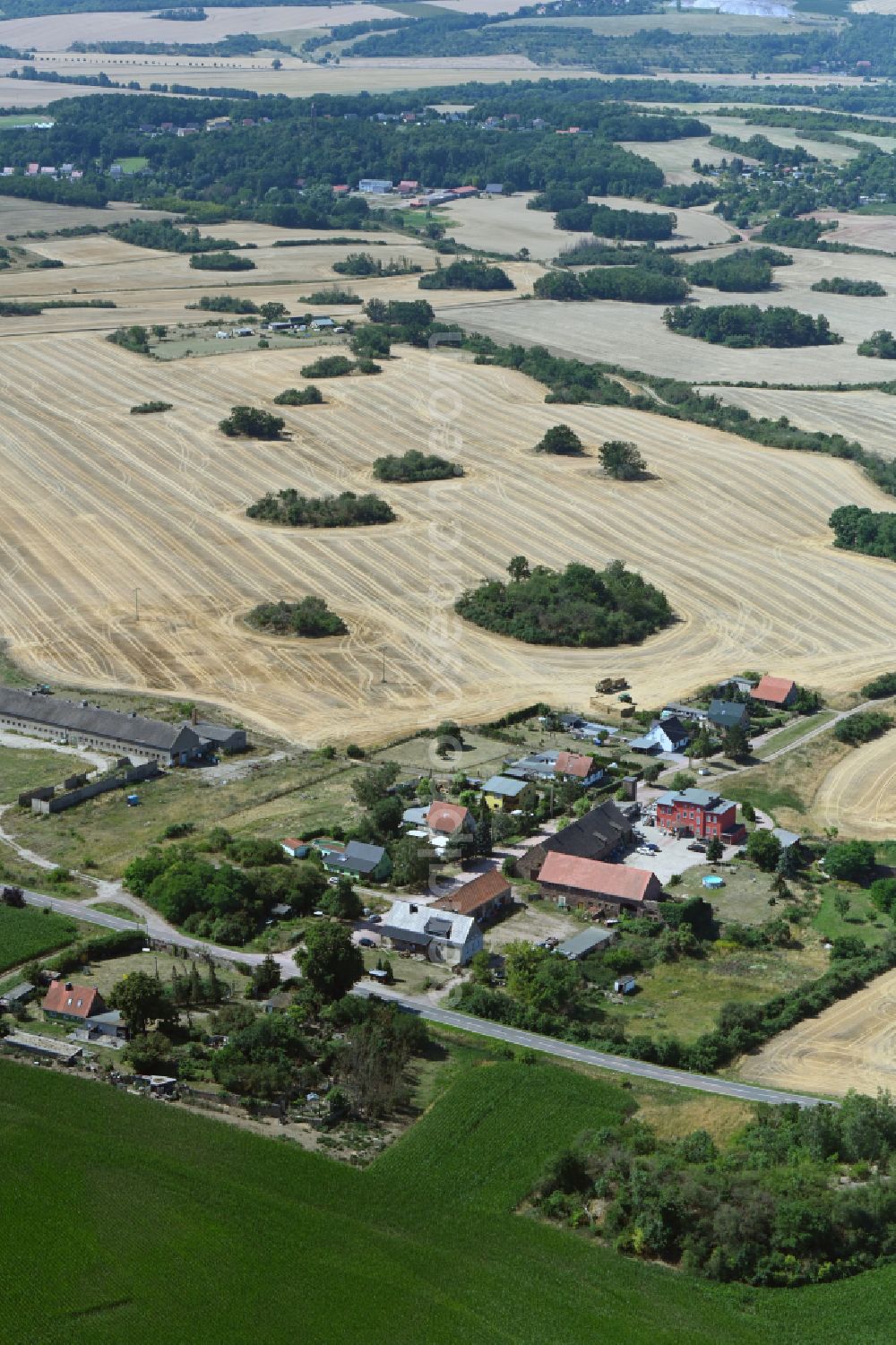 Neutz from above - Agricultural land and field boundaries surround the settlement area of the village in Neutz in the state Saxony-Anhalt, Germany