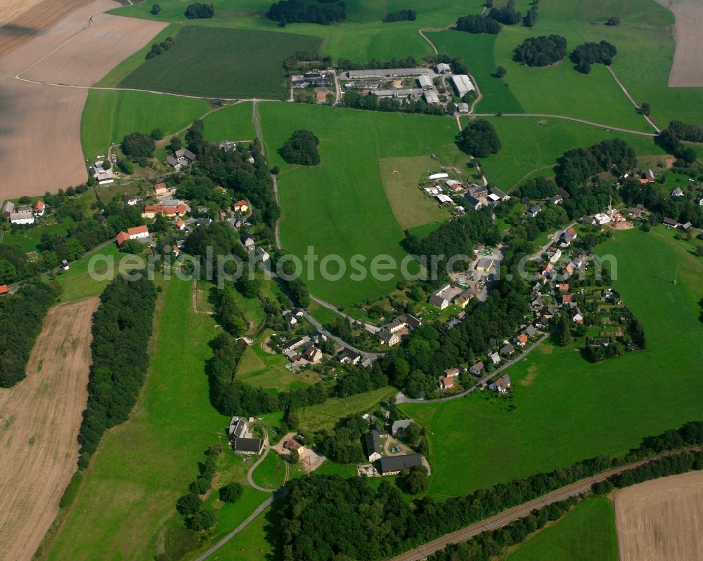Niederbobritzsch from above - Agricultural land and field boundaries surround the settlement area of the village in Niederbobritzsch in the state Saxony, Germany