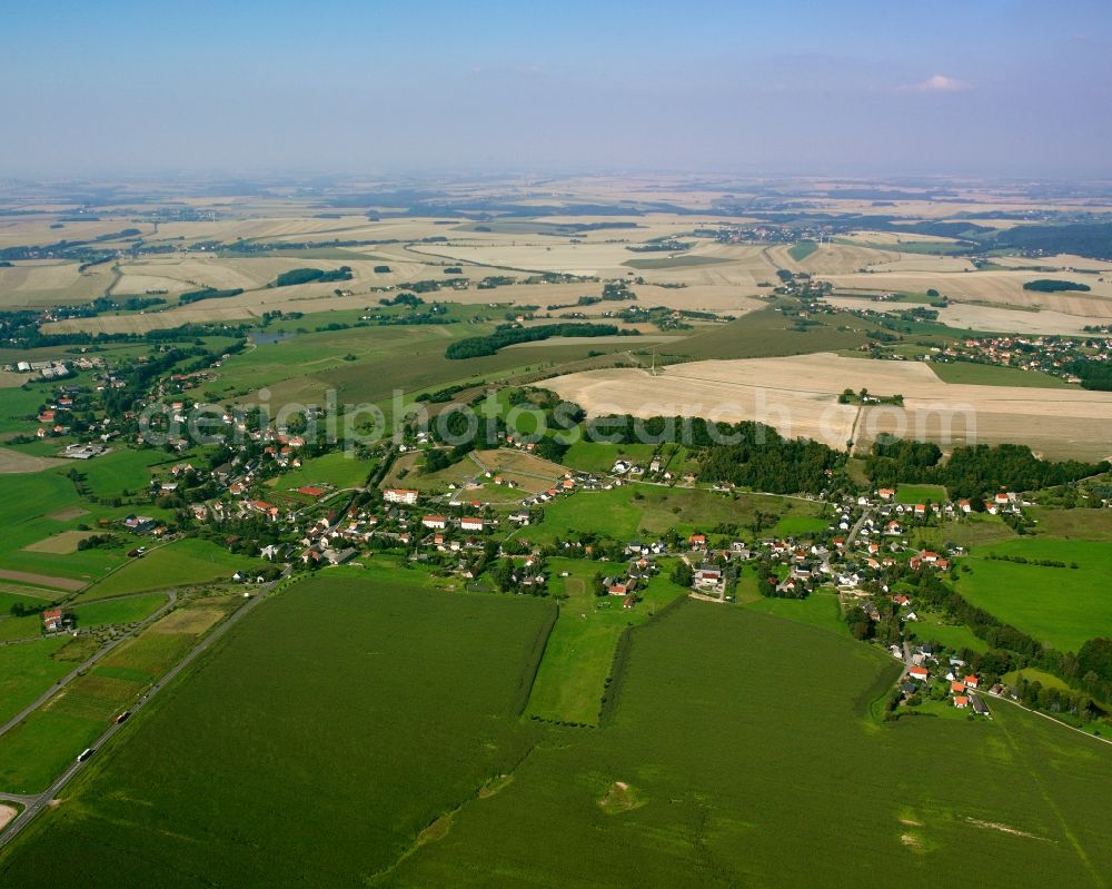 Aerial photograph Niederschöna - Agricultural land and field boundaries surround the settlement area of the village in Niederschöna in the state Saxony, Germany