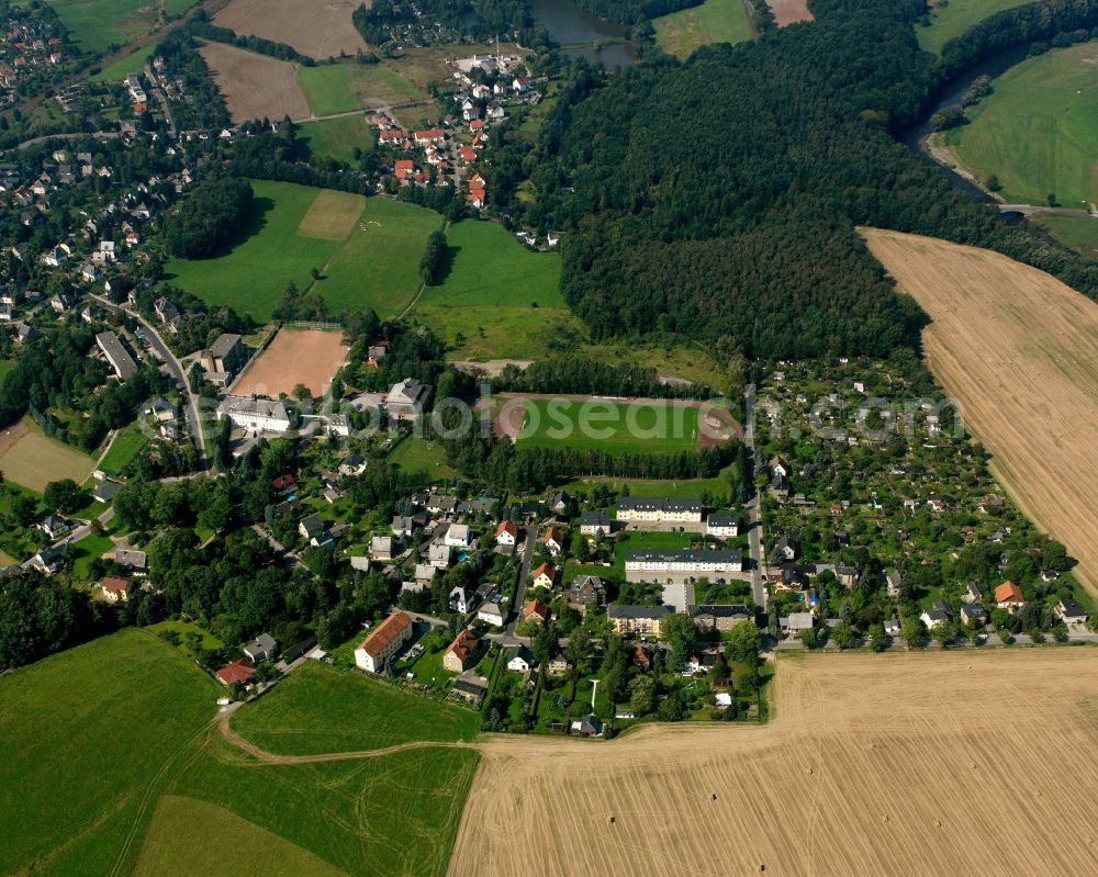 Niederwiesa from above - Agricultural land and field boundaries surround the settlement area of the village in Niederwiesa in the state Saxony, Germany