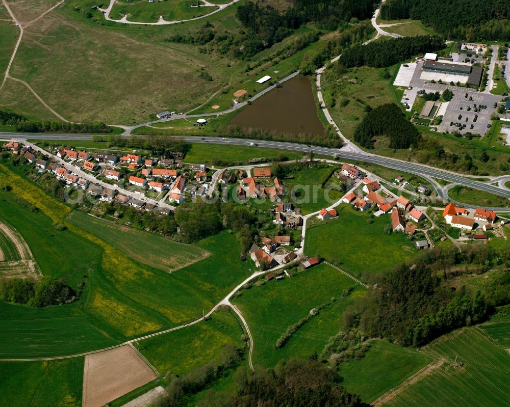 Obereichenbach from the bird's eye view: Agricultural land and field boundaries surround the settlement area of the village in Obereichenbach in the state Bavaria, Germany