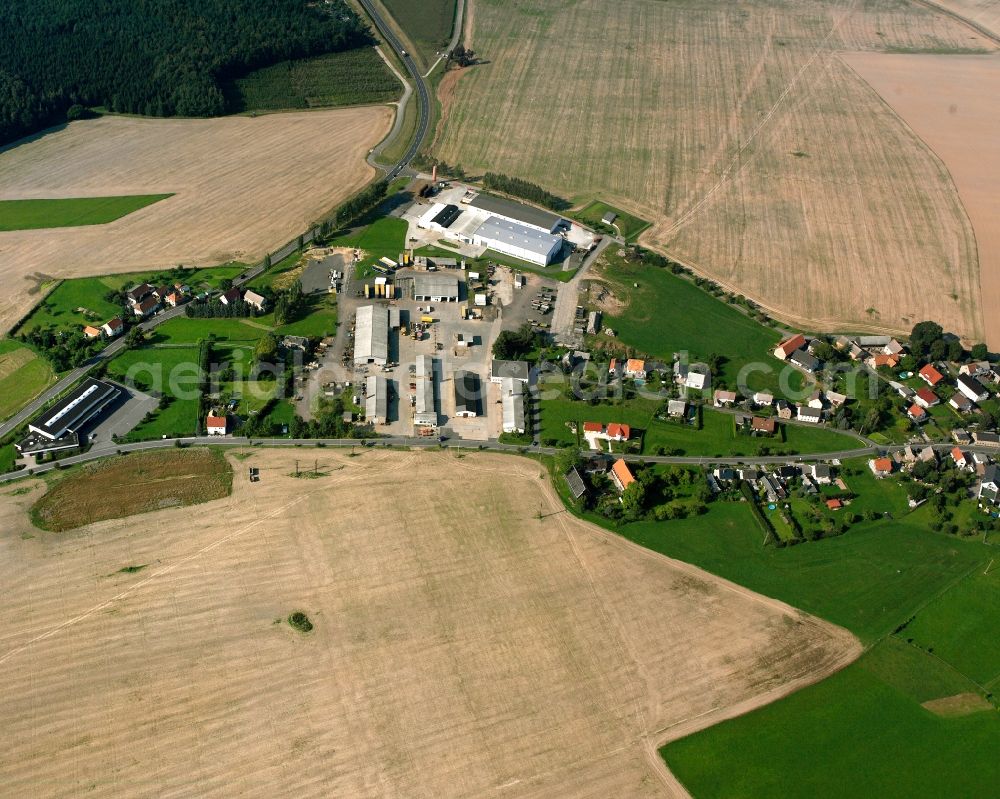 Obergruna from above - Agricultural land and field boundaries surround the settlement area of the village in Obergruna in the state Saxony, Germany