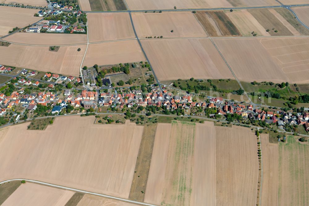 Oberndorf from above - Agricultural land and field boundaries surround the settlement area of the village in Oberndorf in the state Bavaria, Germany