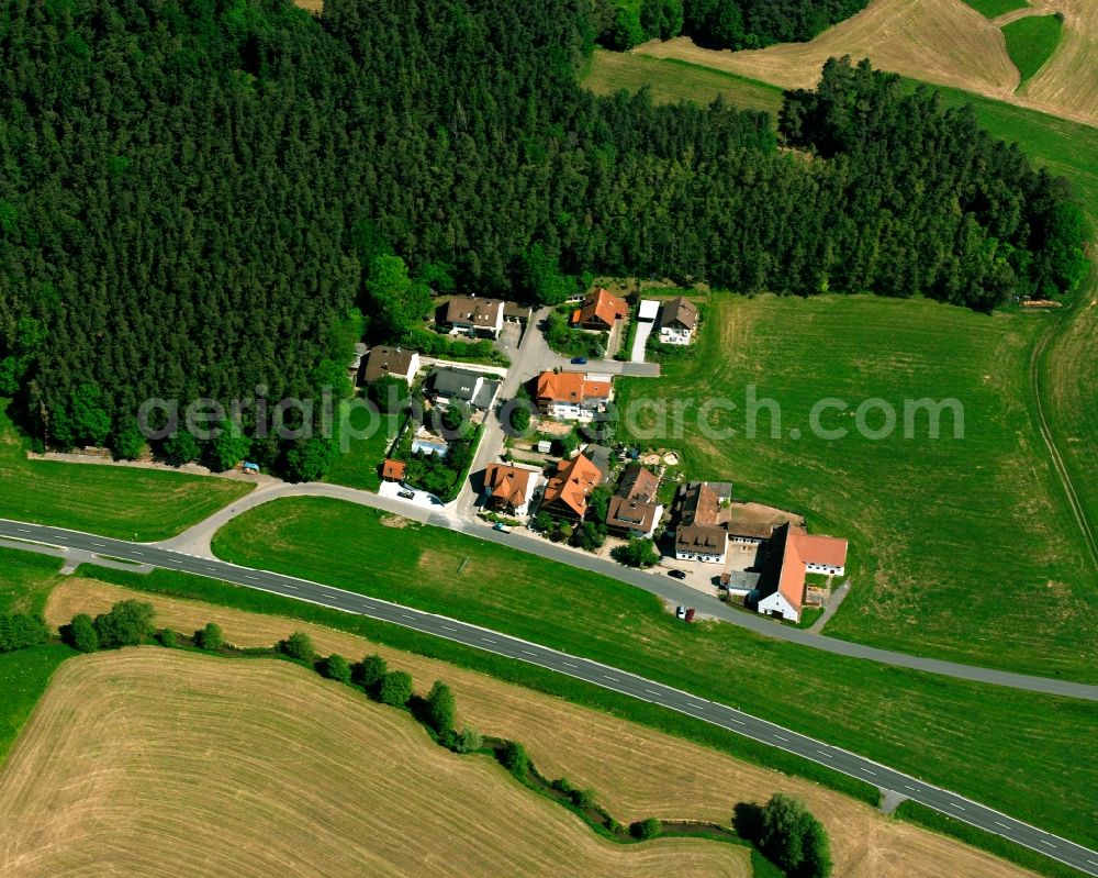 Aerial image Oberschlauersbach - Agricultural land and field boundaries surround the settlement area of the village in Oberschlauersbach in the state Bavaria, Germany
